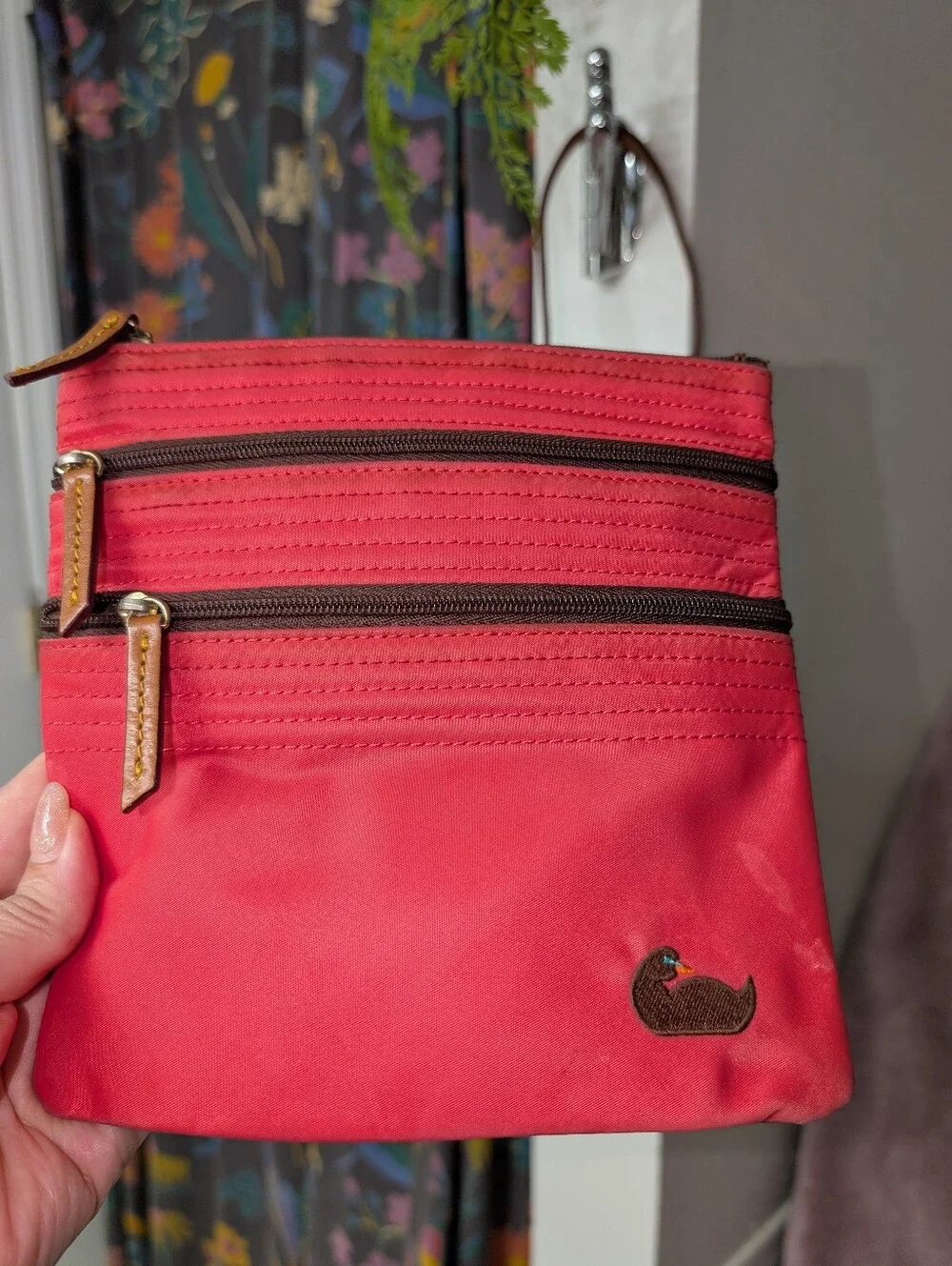 Hot pink Dooney & Bourke Nylon Triple Zip crossbody bag